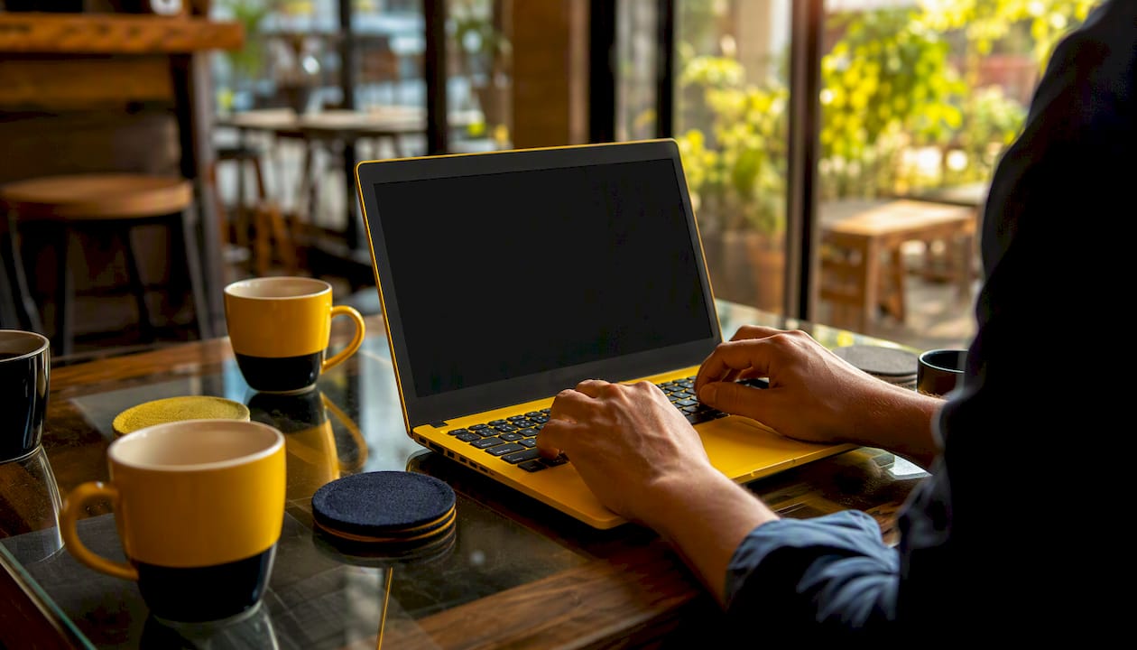 Person compressing a PDF file on a laptop